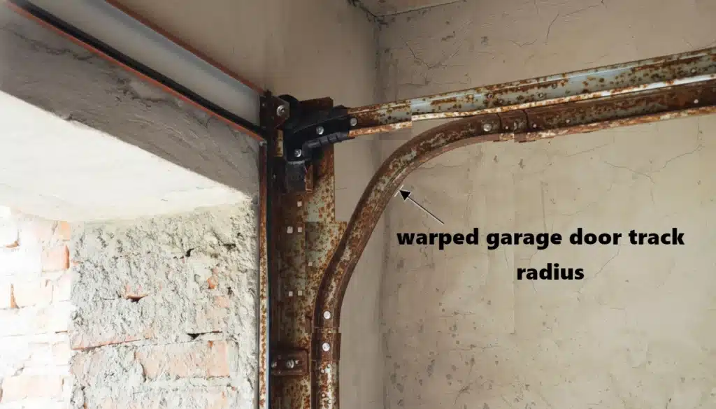 A twisted or warped garage door track radius curve that requires professional replacement.