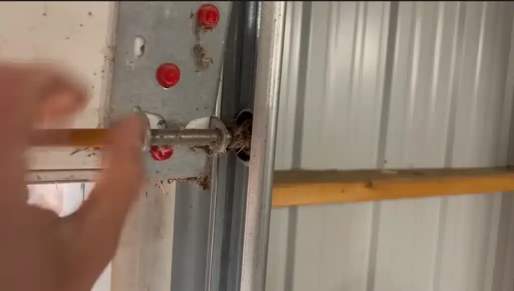 Garage door wheel popping out of the track channel due to wear