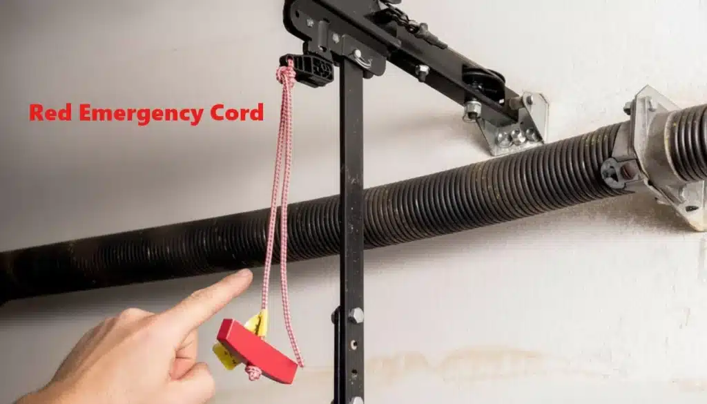 Person pulling the red emergency release cord to disconnect the garage door opener Person pulling the red emergency release cord to disconnect the garage door opener