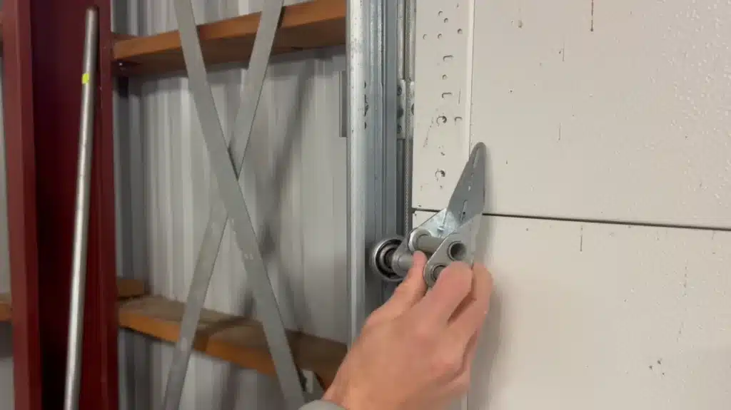Testing for garage door roller wobble and loose hardware